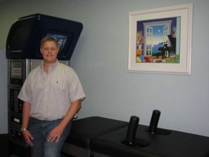 Dr. Randall Laurich shows off the incredible technology in chiropractic care, DRX 9000 machine.