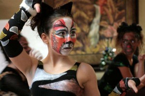 Emma Parssi (foreground) strikes a cat-like pose with fellow dancers Erika Rasso (background, left) and Charlotte Cagaiano while dancing to a medley from the Broadway play "Cats."