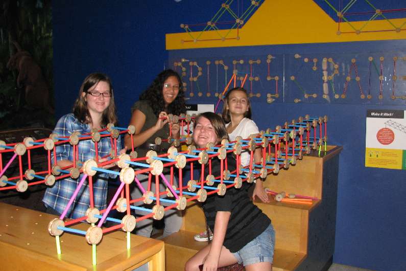 Kids test their engineering skills to build a bridge at the Science Museum.