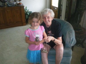 My daughter and my Aunt Shirley, holding a Tibetan prayer wheel and bell in Shirley's home