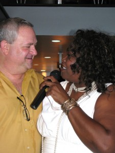 Maryel Epps serenades City Hall owner Steve Haas. Photo by Charlotte Libov.