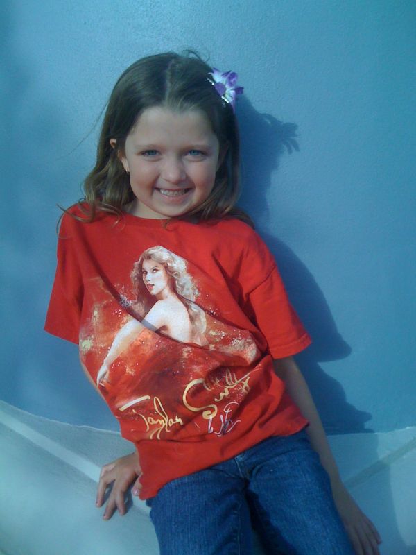 My daughter wearing her favorite shirt, the Taylor Swift concert T-shirt
