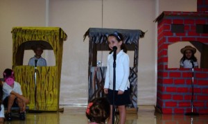 Megan Esposito, played the wolf. As piggy's challenge the wolf in their houses built of straw, twigs and bricks. (Teacher: Lisa Kenny)