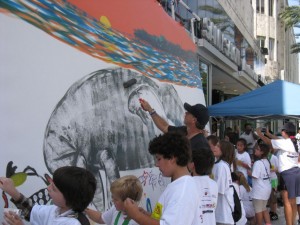 wyland-and-students-painting-the-mural