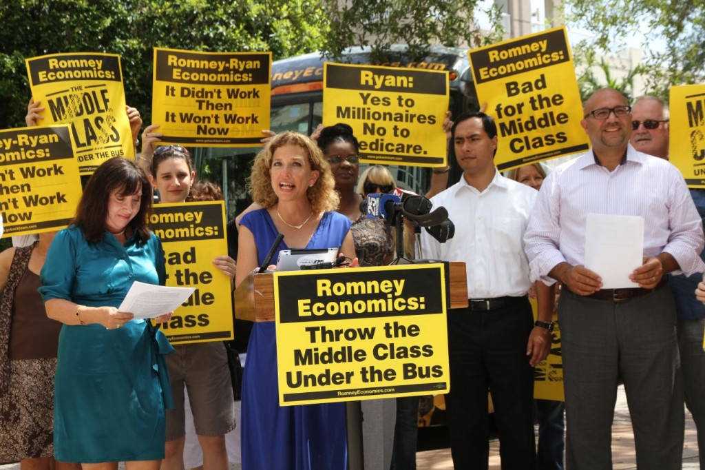 The Democratic National Committee’s “Romney Economics: The Middle Class Under the Bus” Tour II stopped in Miami, Boca Raton, and Tampa on Monday, August 13, to highlight how Mitt Romney and Paul Ryan would “take America backward, undermine the middle class and throw seniors under the bus.”  Among those traveling on the bus tour to Boca Raton were DNC Chair and Congresswoman Debbie Wasserman Schultz, U.S. Rep. Gwen Moore (D-WI), MA State Representative Jeff Sanchez, Senator Maria Sachs and Representative Lori Berman. The press conference took place outside the office of Julie Reiser, President and Co-Founder of Made in USA Certified. Photo by Carol Porter.