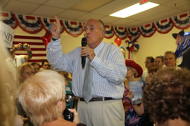 Between three hundred and four hundred people welcomed former New York Mayor Rudy Giuliani at the Boca Raton Romney Victory Office, located at 1962 NE 5th Avenue. Giuliani was introduced by County Commissioner Chip LaMarca and former legislator Adam Hasner. Photo by Carol Porter.