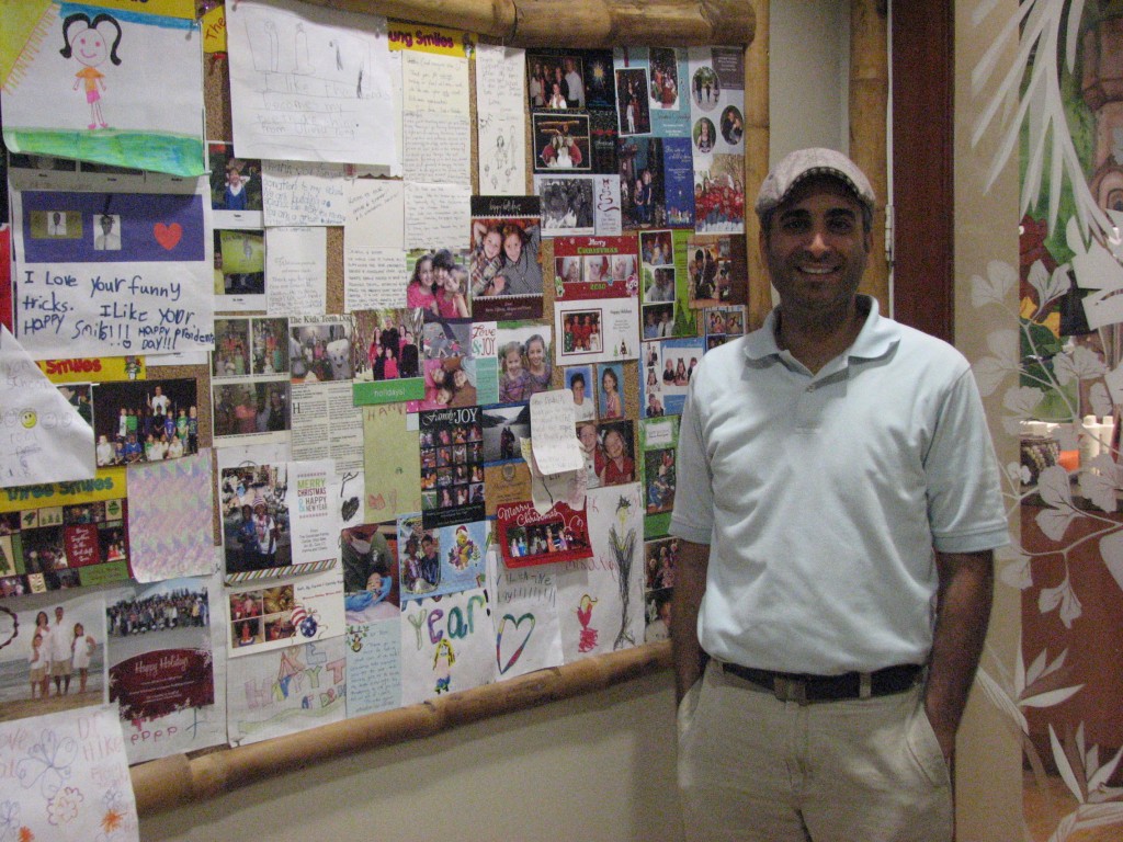 Dr. Tomer Haik, "The Kids Teeth Doctor" stands by his bulletin board of "thank you" letters from patients. See related story this month under "AW Spotlight" (for October, 2012). Also see Dr. Haik in this month's Letter from the Editor video.