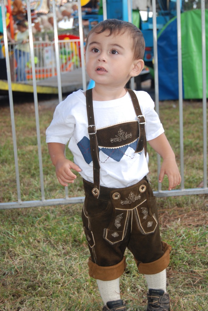 Little boy in Lederhosen enjoying Oktoberfest at the American-German Club. Photo by Elien Boes.