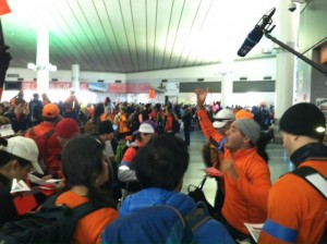 Erol organizes runners at the Staten Island Ferry terminal.