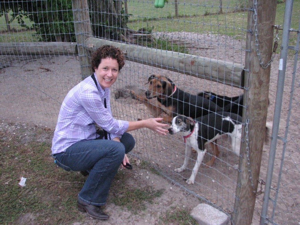 Lorrie Browne visits with a couple of the dogs at the Big Dog Ranch Rescue in Wellington.