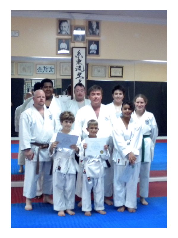 1st row standing, (L. to R.): Lucas de Guardiola, Weston Clark, Vanessa Tavera. 2nd row standing (L. to R.): Instructor Brent Bedwell, Chief Instructor Sensei Keith Moore, Instructor Catherine Mazzella. 3rd row standing (L. to R.): Oscar Carranza, Mike Taplin, Charles Vlahos.
