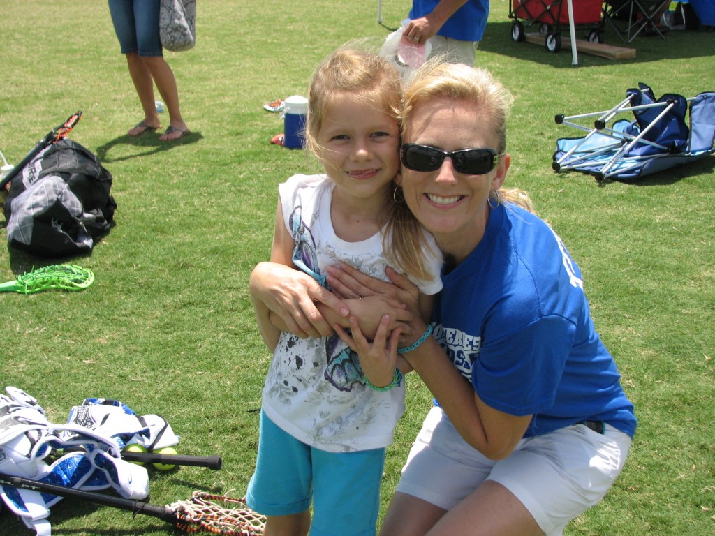 Shawn Thompson, advertising representative for AroundWellington.com and her daughter, at a lacrosse festival and fundraiser event, held behind the Hampton Inn in Wellington, FL.