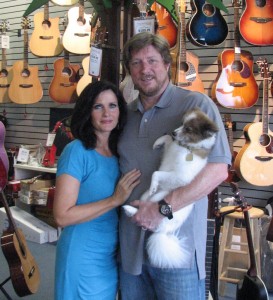 Donna and Steve Willey of Village Music in Wellington, along with their dog Benji.