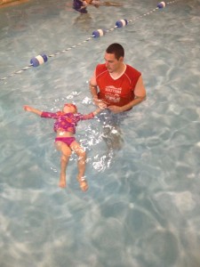 One young student learning the importance of floating on her back, a survival skill