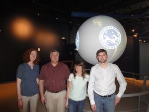 The Science on a Sphere exhibit and the team who installed it at the South Florida Science Center.