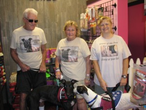 Promoting Hounds & Heroes.  Middle: Barbara Masi. Right: Carolee Ellison.  At the ice cream social in August at Woof Gang Bakery in Wellington .