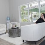 Julie-Khanna-taking-a-call-in-the-seated-area-at-Khanna-House-Studios