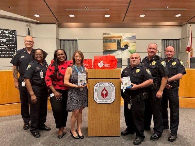 Police officers and transportation staff receive kits to help measure and manage blood pressure